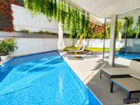 living - Piso de 560m² con 300m² de jardín en venta en Conde de Orgaz y Piovera - gallery thumbnail - 10